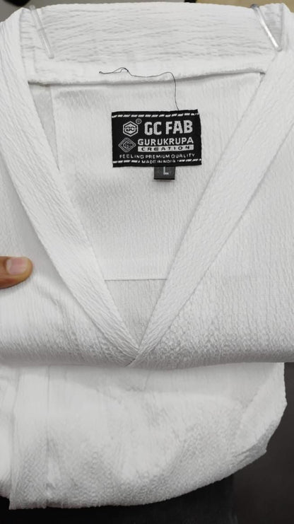 Mens Crinkled Co-Ord Set White displayed, showcasing the texture and label of the garment.